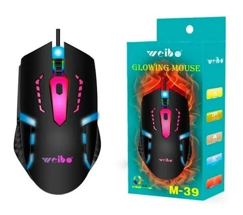 Un MOUSE GAMER M39 negro con luces LED de colores se muestra junto a su embalaje, que presenta la misma imagen de ratón, diseños vibrantes y texto.